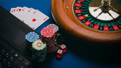 to wager; to bet; to risk; to stake; to gamble — 賭ける